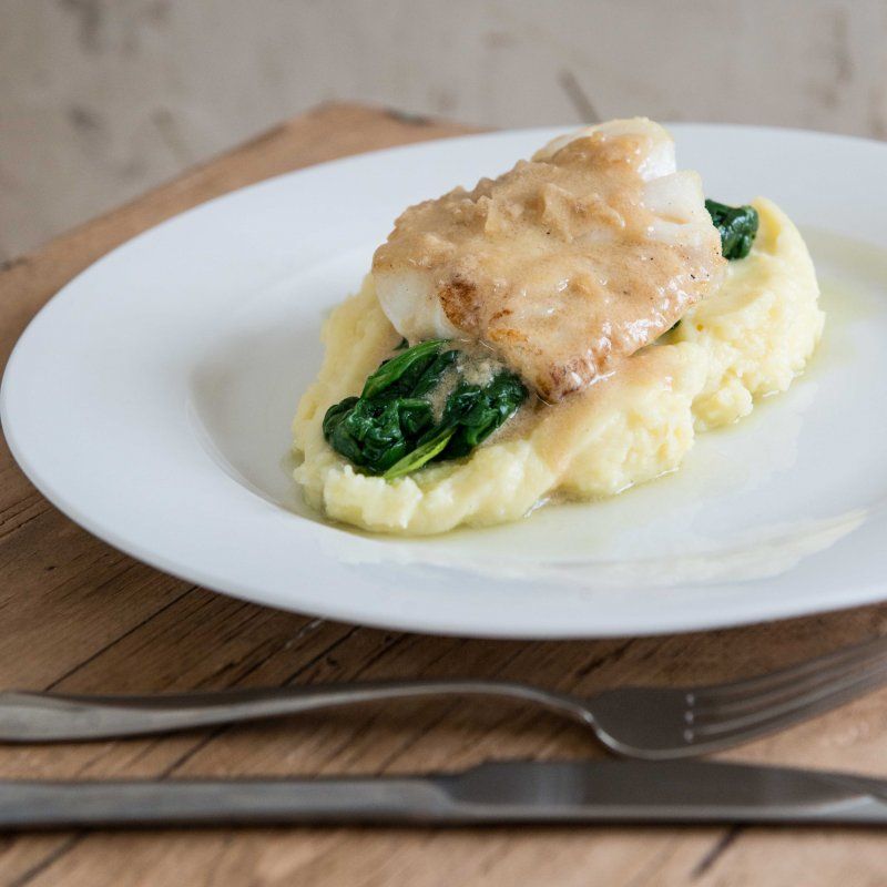 Kabeljauwhaasje met lookpuree en saus van bier