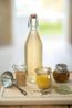Beugelfles facet, glas, porseleinen dop, 1 liter Beugelfles facet, glas, porseleinen dop, 1 liter