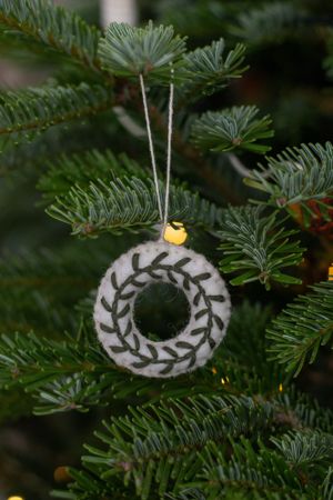 White felt, wreath-shaped Christmas decoration