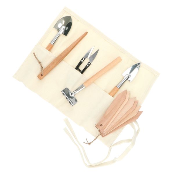 6 miniature gardening tools in a case