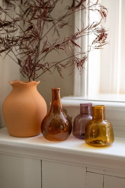 Terracotta coloured recycled glass ball-shaped vase