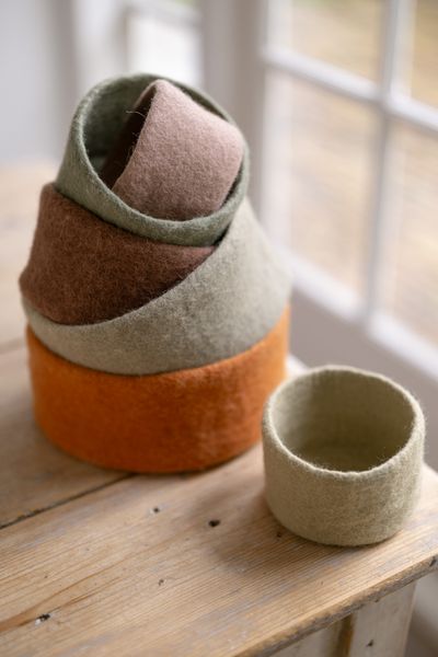 Small, green, round felt basket