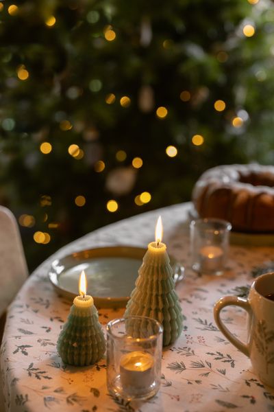 Small, dark-green ribbed Christmas tree candle