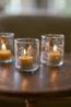 Glass tealight holder with engraved twigs