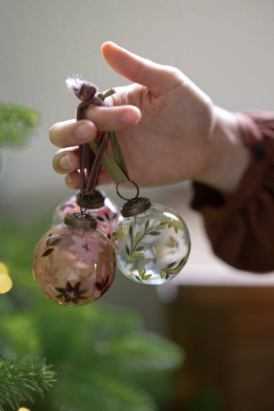 Small, pink-red, hand-painted glass Christmas bauble